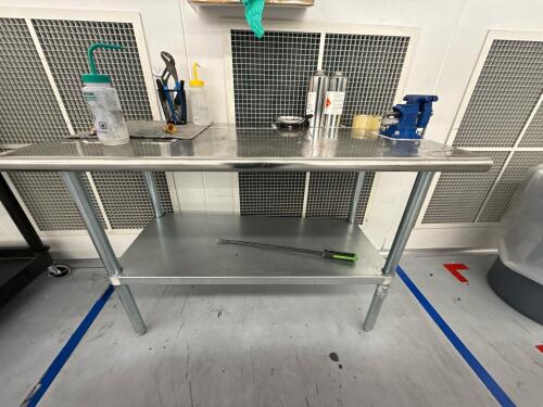 Stainless steel table with bench vise