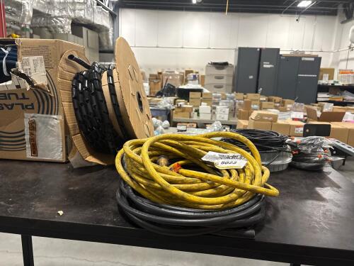 Extension cord and plastic tubing.