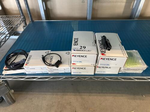 LOT OF ASSORTED KEYENCE ACCESSORIES; (4) SENSOR HEAD-HIGH PRECISION MODEL: GT2-A12KL; (4) PHOTOELECTRIC SENSORS MODEL: PZ-G42EN; (2)LUSTER CANCELING ATTACHMENT MODEL: LR-WA1 (LOCATION: BACKROOM GIGAFACTORY)