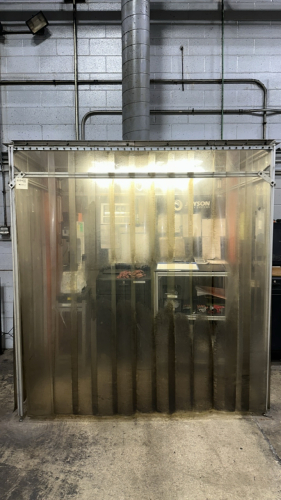 CUSTOM BOOTH WITH CURTAIN STRIPS AND CEILING VENTILATION HOLE
