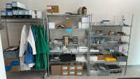 LOT OF (3) RACKS OF ASSORTED LABORATORY EQUIPMEMT, TO INCLUDE: SAFETY GLASSES, COTTON TIPPED APPLICATORS, LAB COATS, ASSORTED BEAKERS, ETC.