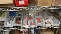 WIRE RACK WITH ASSORTED ITEMS TO INCLUDE: ULINE BIONIC FACE SHIELD, SCREWS, DUSTER, TUBING, EYE WASH FLUID, ETC. - 4