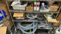 WIRE RACK WITH ASSORTED ITEMS TO INCLUDE: ULINE BIONIC FACE SHIELD, SCREWS, DUSTER, TUBING, EYE WASH FLUID, ETC. - 5