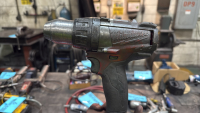 A Milwaukee Cordless Drill and A Milwaukee 2780-20 Grinder. - 2