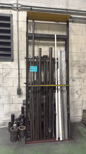 Metal rack w/misc flat metal and piping