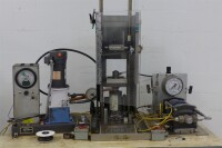 Testing Station including Carver 2759-1 Hydraulic Press, Hydraulics International 5L-SD-230 Air Driven Liquid Pump, Pressure Chamber, Gauges, Accessories & Table