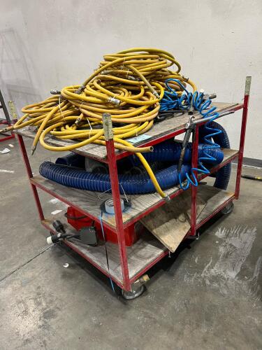 Assorted air compressor hoses on rolling industrial cart