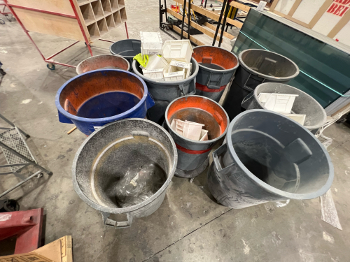 Lot of 9 industrial trash cans