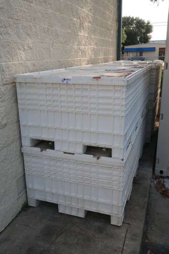 Plastic Stackable Crates with Contents of Crossby Duwar Tank Insulator Jackets
