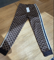 Gucci women's brown logo intarsia knit side stripe jogger pant